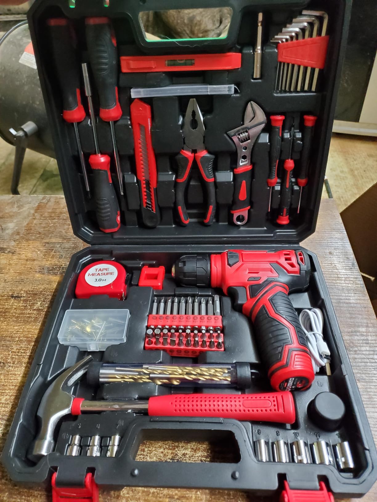 Toolbox with cordless drill, bits, and hand tools